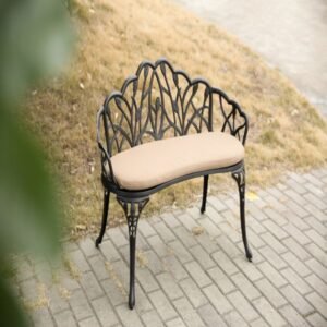 Black cast aluminum garden bench with cushion viewed from above