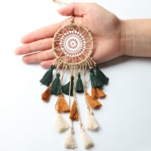 Tricolor mini dream catcher shown in hand for scale
