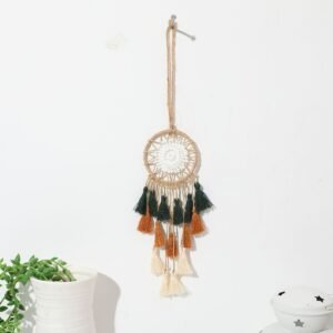 Mini tricolor dream catcher hanging on a light wall